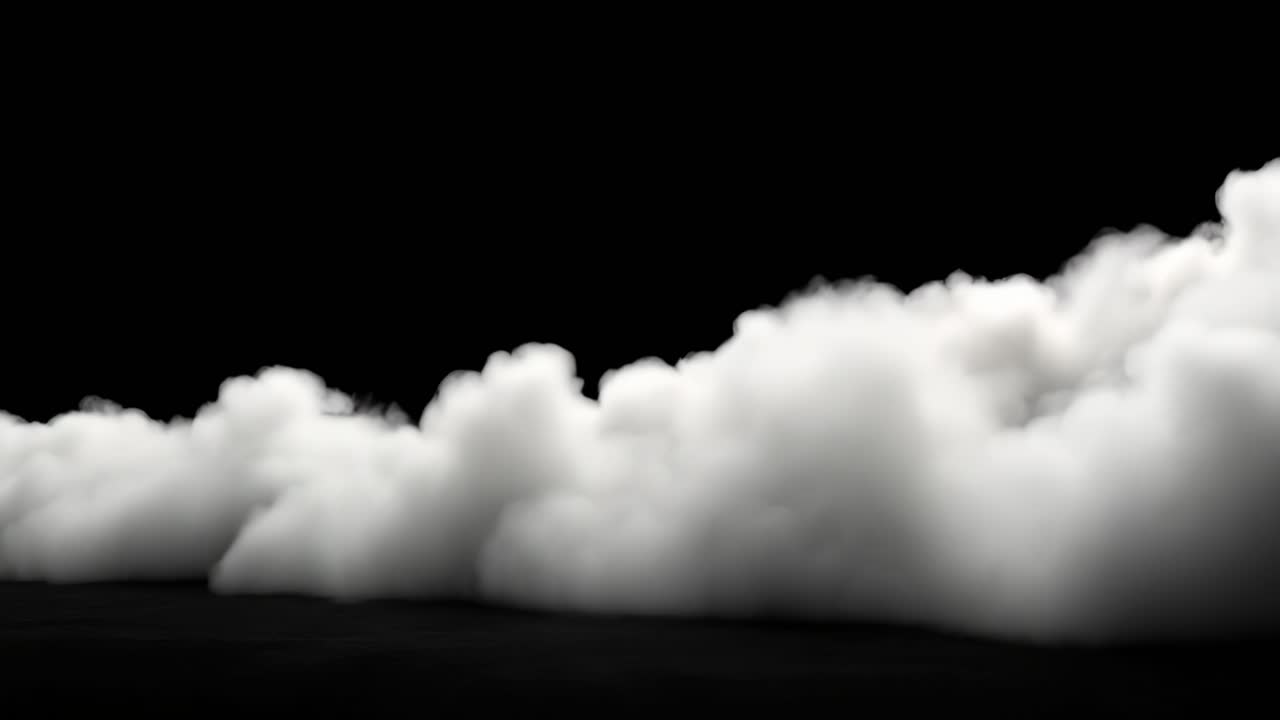 Fog rolling across a dark landscape. Billowing fog spreads across a dark surface, creating a misty atmosphere that obscures visibility in the background.