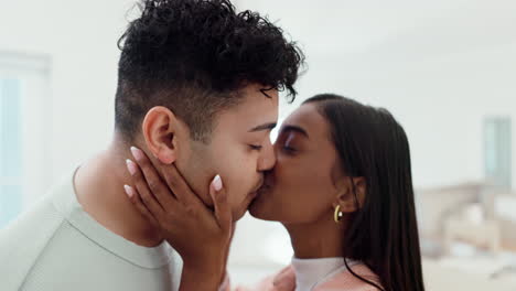 face, young couple and kiss in home for love