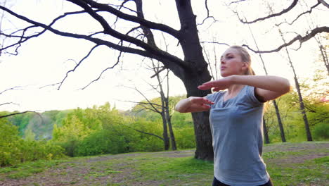 attractive woman warming up before jogging