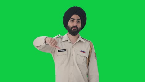 disappointed sikh police indian man showing thumbs down green screen