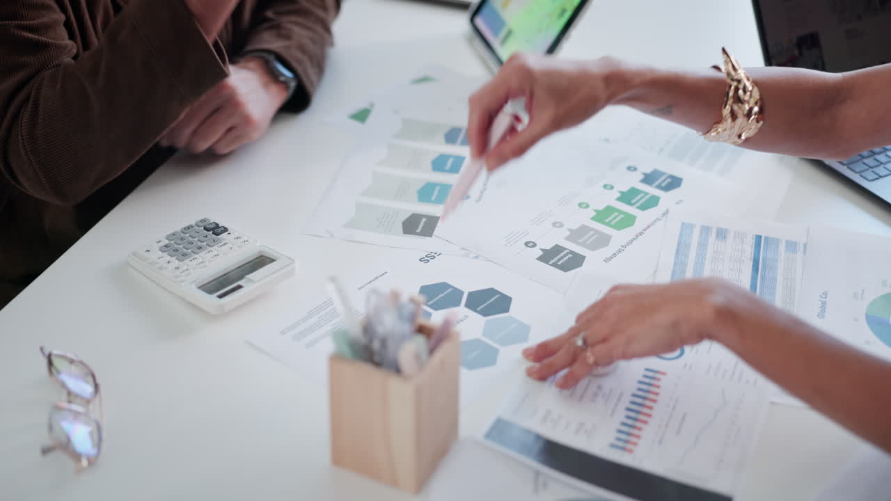 Business Professionals Analyzing Financial Data and Marketing Strategy Documents