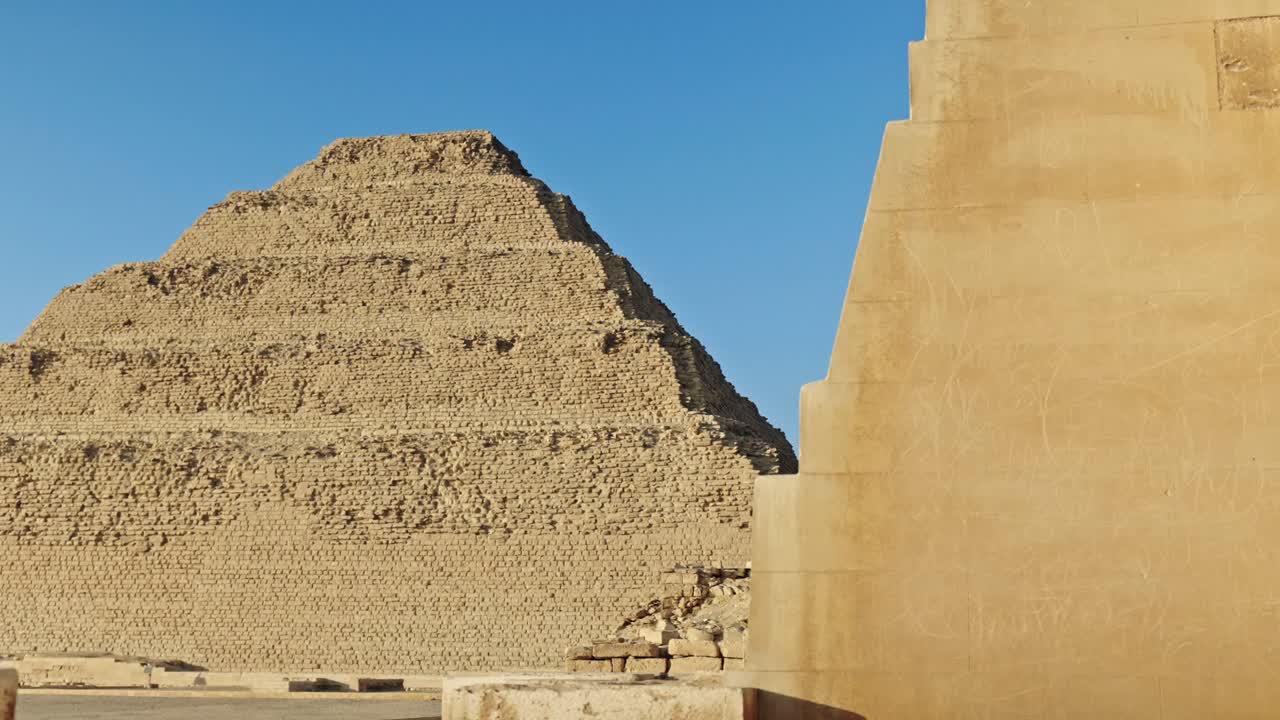 This image captures the iconic Step Pyramid of Djoser, a monumental structure in the Saqqara necropolis, Egypt