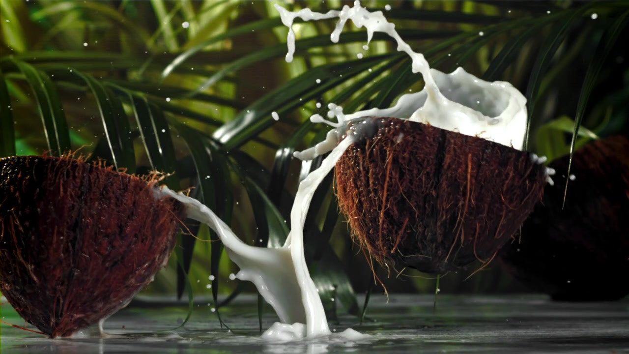 Fresh Coconut Splitting and Splashing Milk in Slow Motion