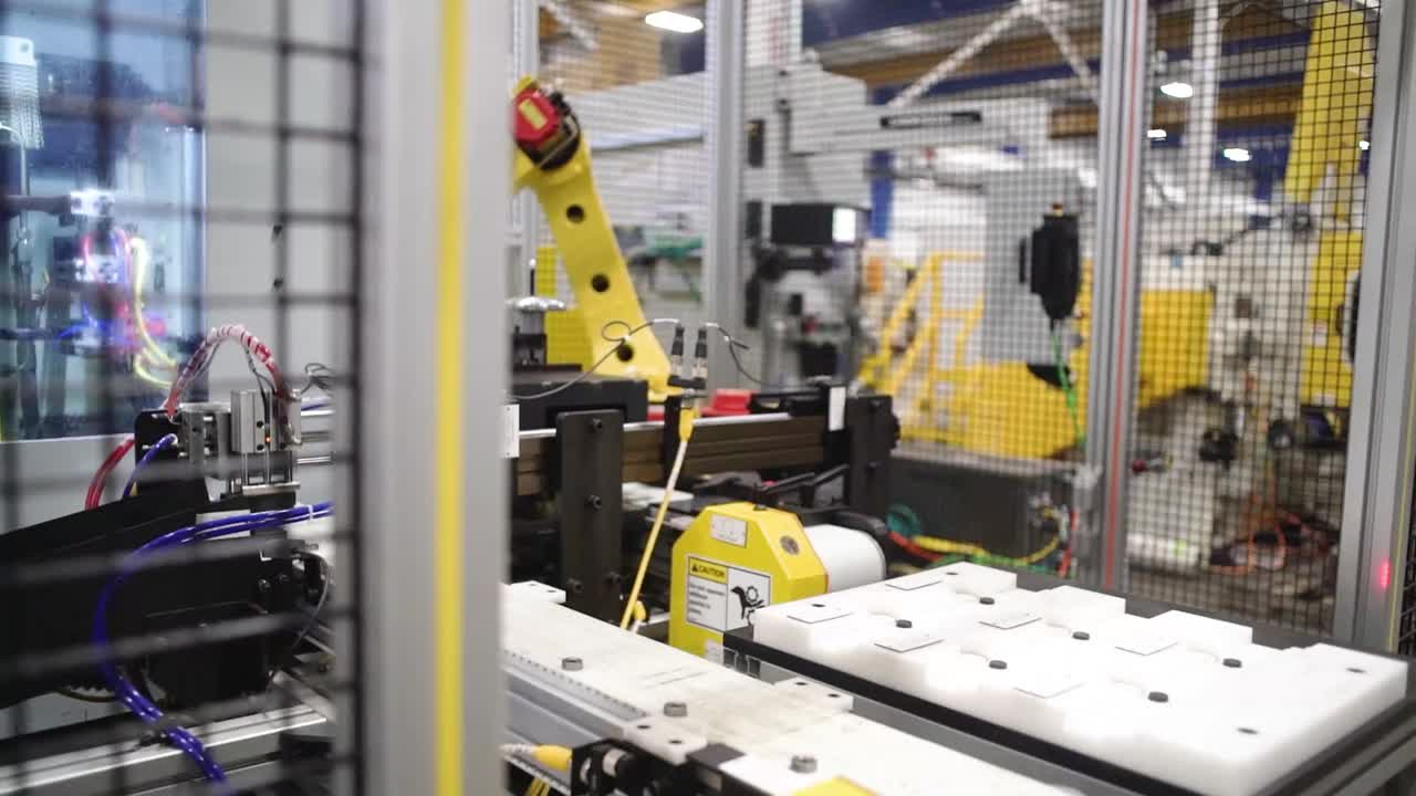 Fully automated double disk grinder making parts for the automotive industry at a manufacturing plant in Howell, Michigan
