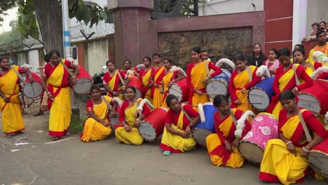 rural women drummers at red road for durga puja procession in kolkata, india.