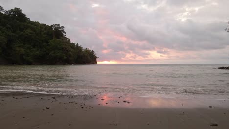wide-shot-of-a-nice-orange-sunset-on-a-sandy-beach-of-a-tropical-island