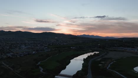 Golden-sunset-aerial-hyper-lapse-over-a-golf-course-in-the-suburbs