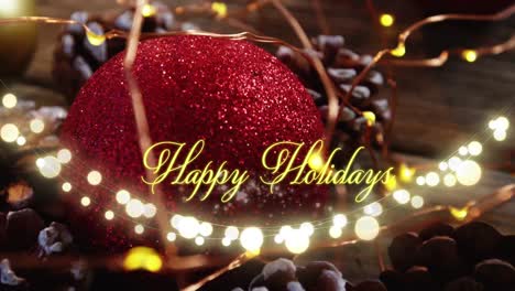 animation of happy holidays text over christmas tree decorations