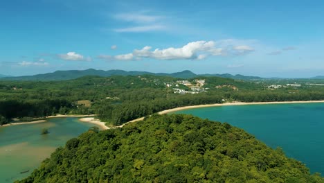 4K-Cinematic-nature-aerial-footage-of-a-drone-flying-over-the-beautiful-beach-of-Bang-Tao-in-Phuket,-Thailand-on-a-sunny-day