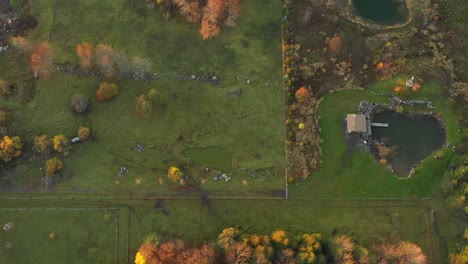 house-on-pond-in-amazing-country-fall-colours