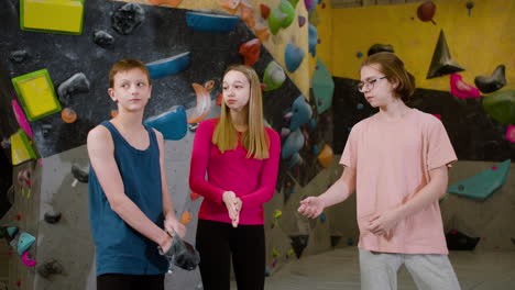 friends using climbing chalk