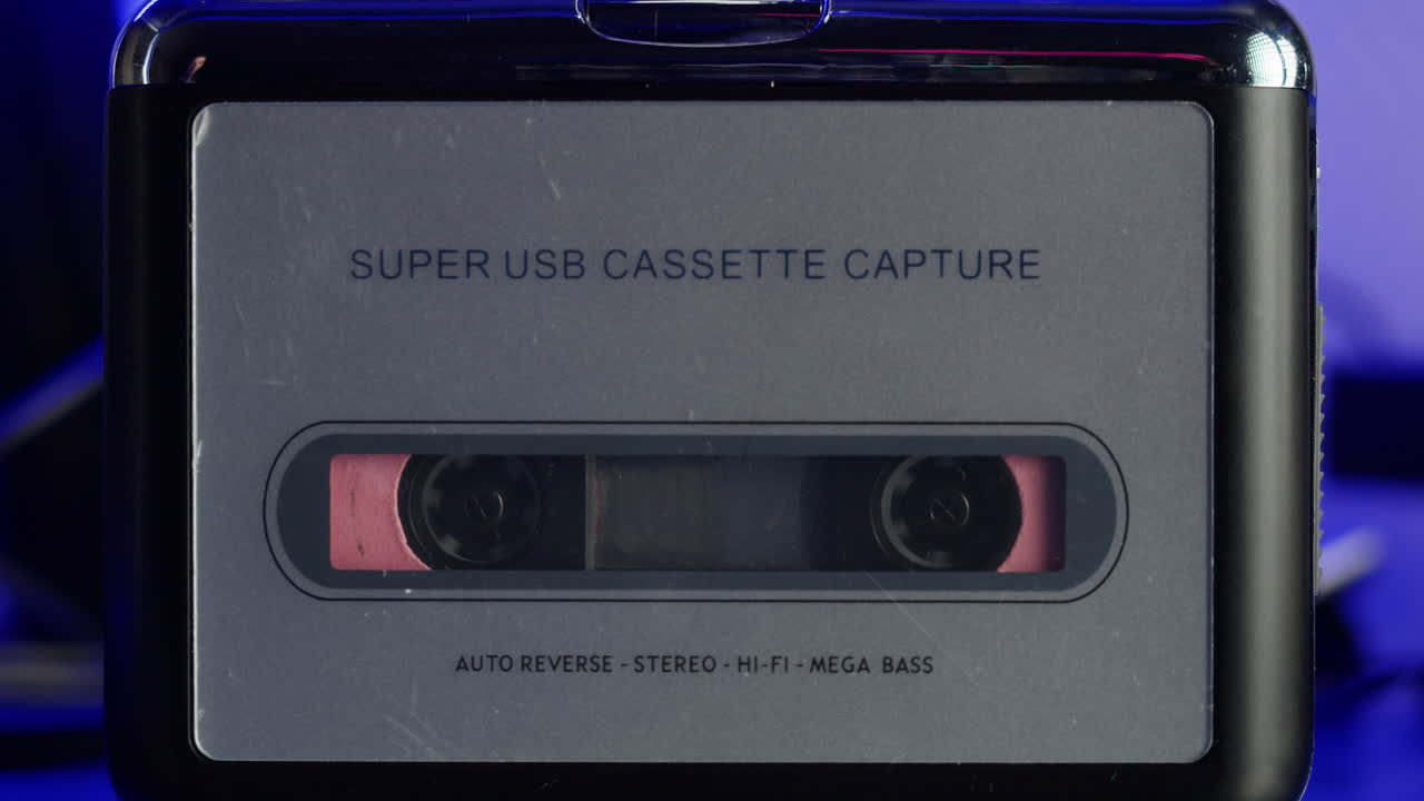 Close-up of a vintage audio cassette tape showing wear marks and magnetic tape reels in retro style.