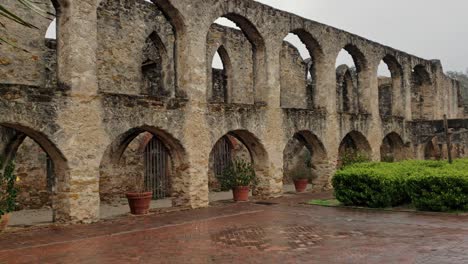 architecture design of archways from old mission fort with trees plants and bushes