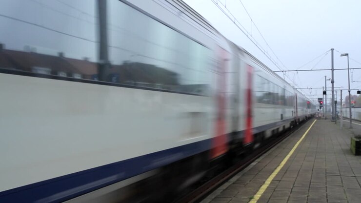 Belgium train passing railway station