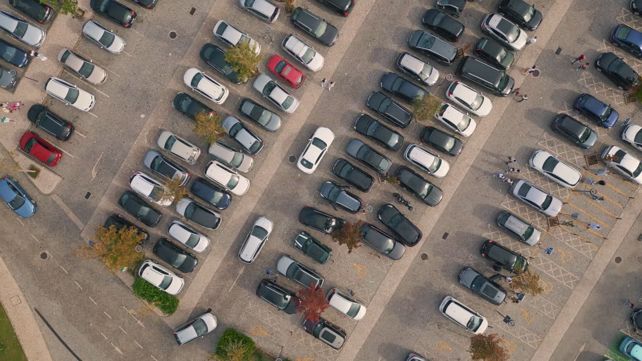 Drone cars riding parking full of automobiles. Vehicles moving on asphalt road