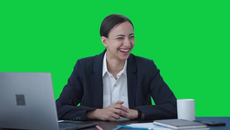 Happy-Indian-female-manager-talking-to-employees-Green-screen
