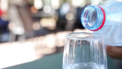 pouring water into a glass