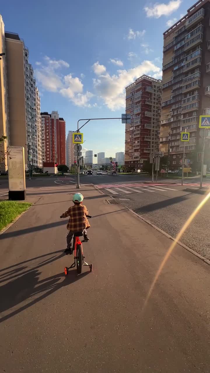 Child riding a bike in the city