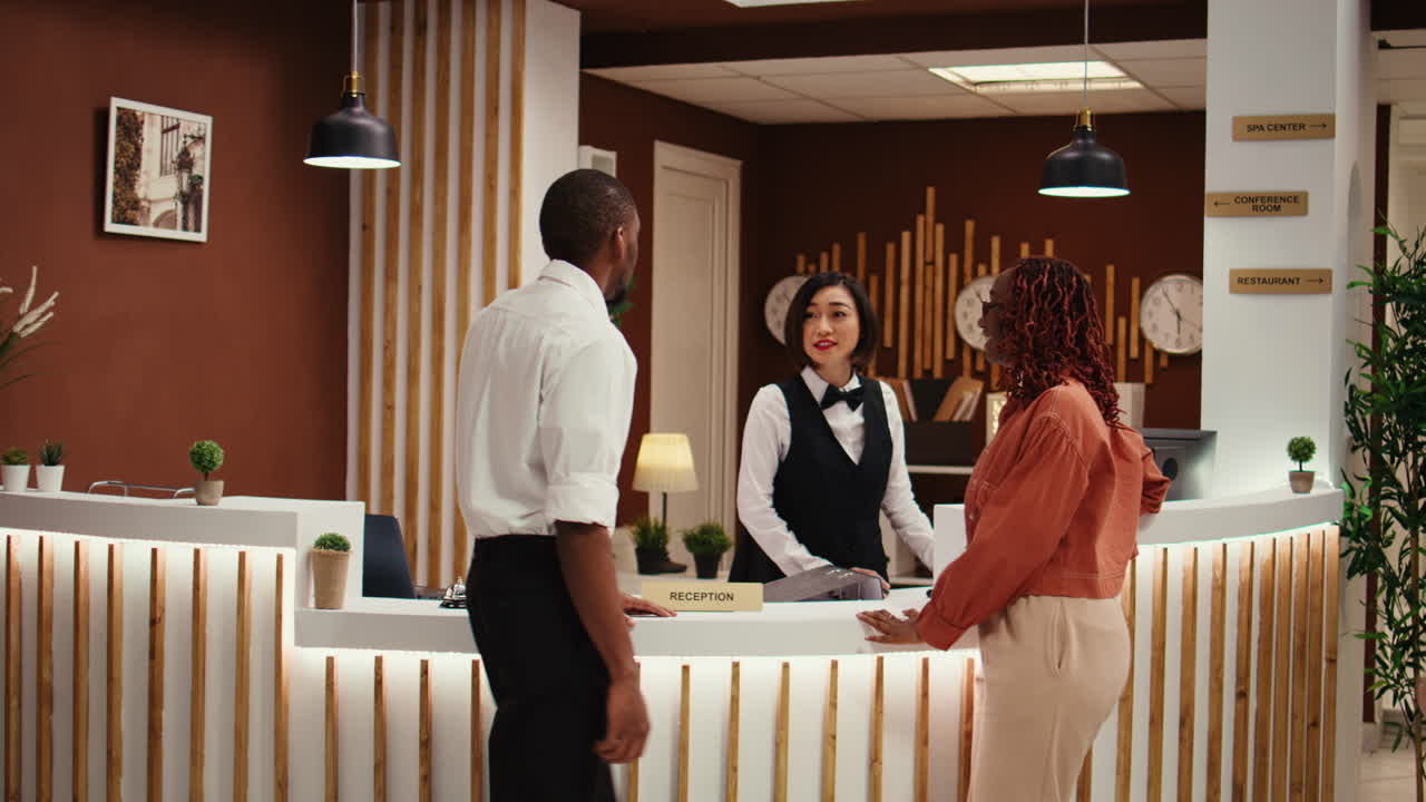 Bellboy helping arriving guests