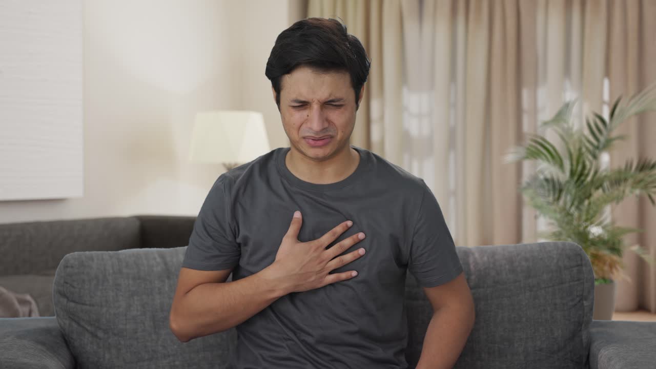 Sick Indian man suffering from acidity