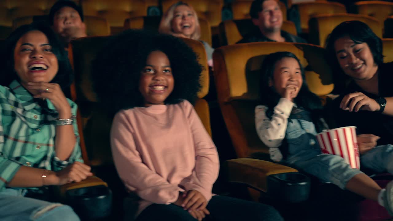 People audience watching movie in cinema theater.