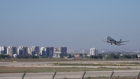 passenger plane registration taking off from large airport