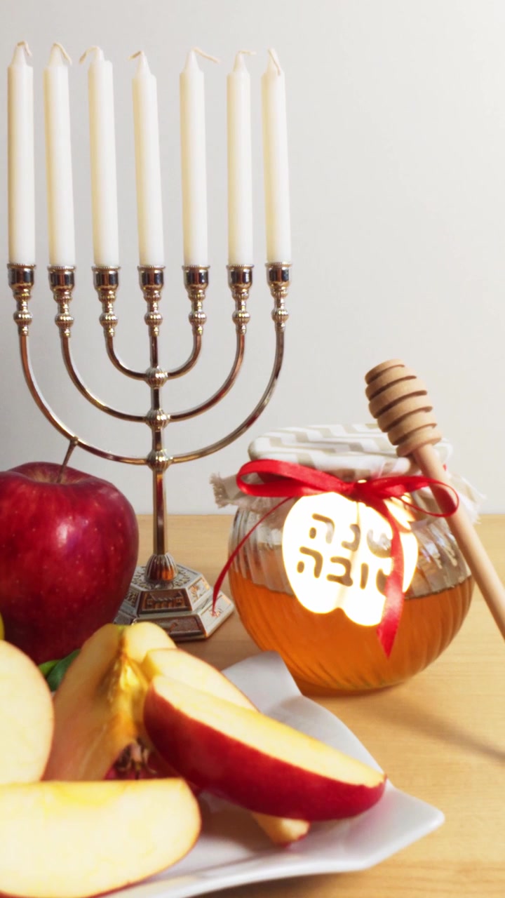 Rosh hashanah table with honey apple and menorah