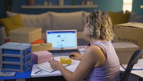 e-commerce entrepreneur talking to her customer on the phone.