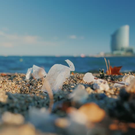 plastic and other garbage on the beach in barcelona