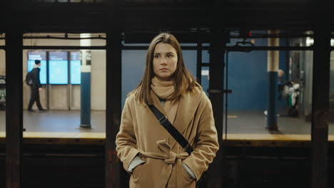 woman waiting at a subway station