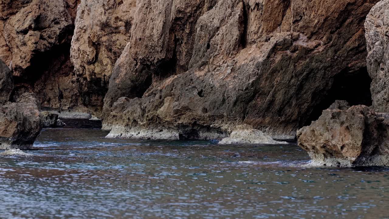 Rugged Coastal Rocks and Shallow Waters with Textured Shoreline in Central Vietnam