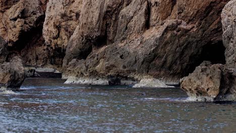 rugged coastal rocks and shallow waters with textured shoreline in central vietnam