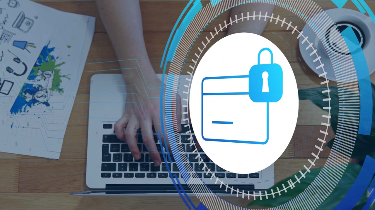 Grafica di sicurezza che appare e ruota sopra un laptop mentre le mani digitano, mostrando la protezione del portafoglio.