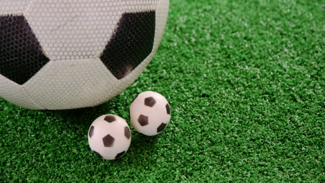 footballs on artificial grass 4k