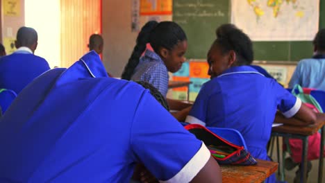 schoolgirls talking in a lesson at a township school 4k