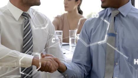 shaking hands, businessmen with chemical structure animation overlay in office setting
