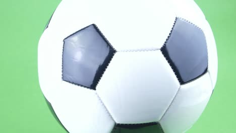 soccer ball spinning on a green background. football. championship. europe. world. olympics. sport.