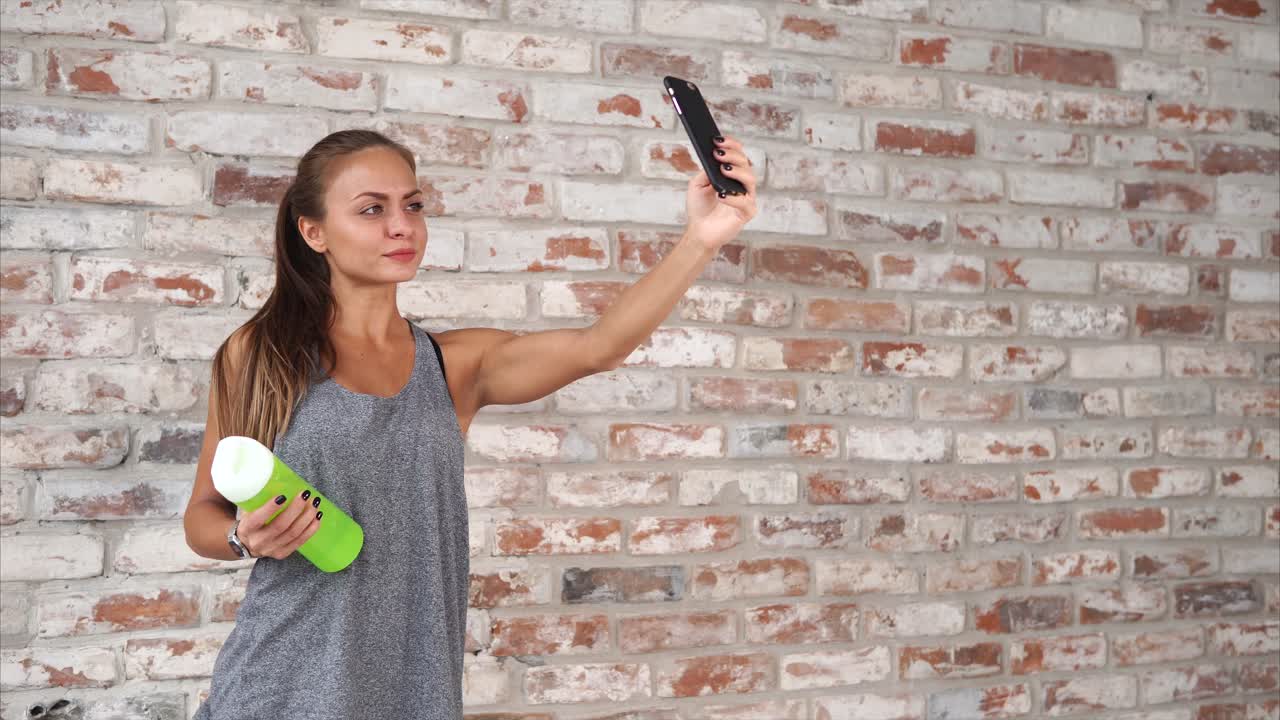 Woman taking a selfie after workout