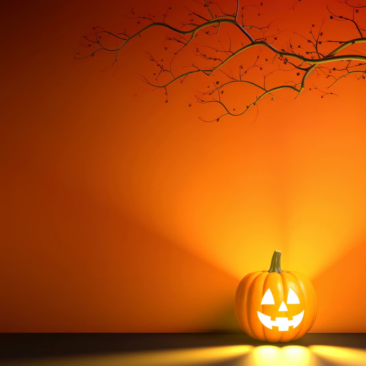 Low-angle shot of a glowing jack-o'-lantern under a bare branch, set against an orange backdrop