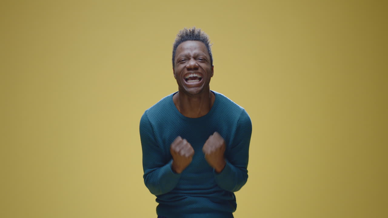 A man expresses strong emotions of frustration and despair