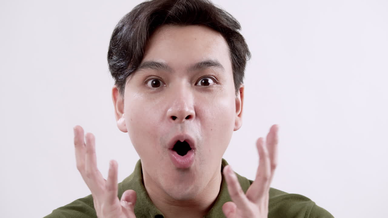 Close-up shot of a male individual showing an expression of surprise.