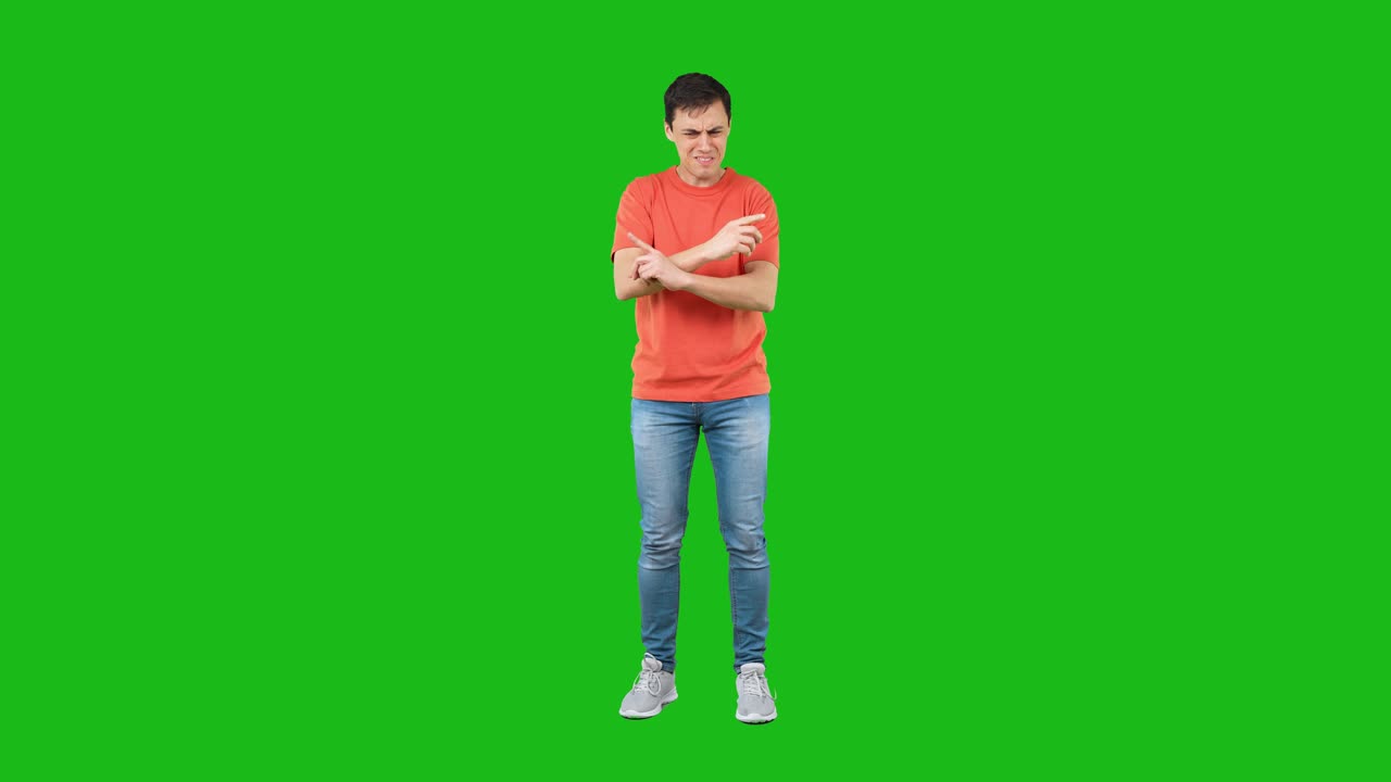 Man Expressing Confusion and Frustration on a Green Screen