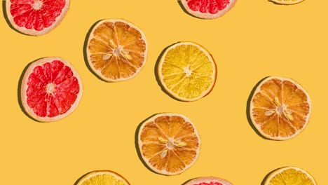 fondo de rebanadas de cítricos, naranjas y limones cayendo. fruta fresca. bucle. 4k.