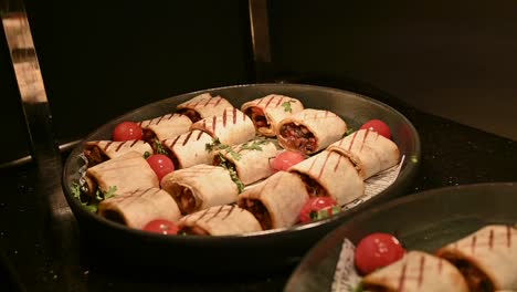 chicken shawarma pieces stuffed with barbecue sauce under a hot plate