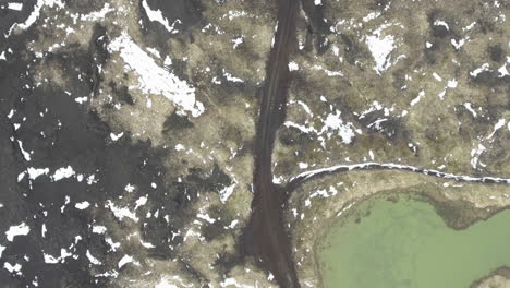 this drone footage captures iceland's rugged and barren landscapes, showcasing its remote and wild beauty