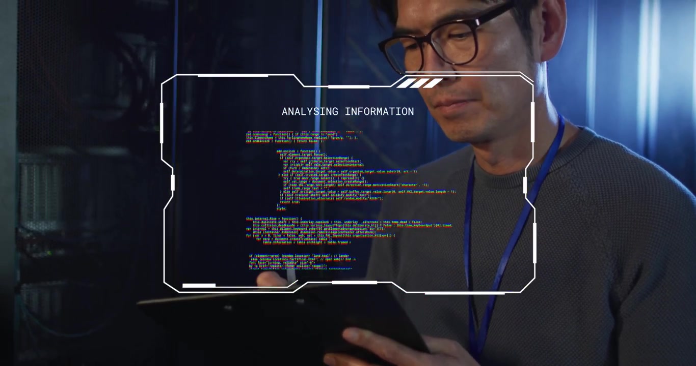 Male IT tech tapping tablet with stylus in server room analyzing HUD code glitching and restoring