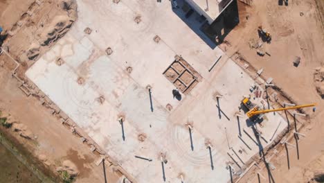 he construction site revolves around a crane in the center, captured on camera