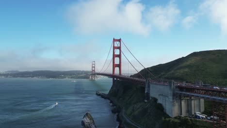 drone ascends over golden gate bridge with cars driving (60fps)