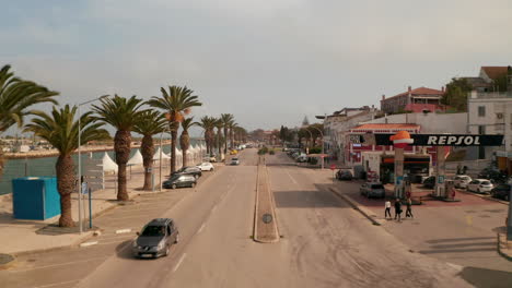 Aerial-drone-view-of-Avenida-dos-Descobrimentos-street-in-historical-city-of-Lagos,-Portugal,-dolly-in,-sunny-day