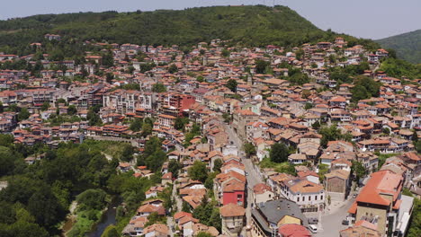 panoramic slide view of veliko tarnovo hill city and terracotta roofs